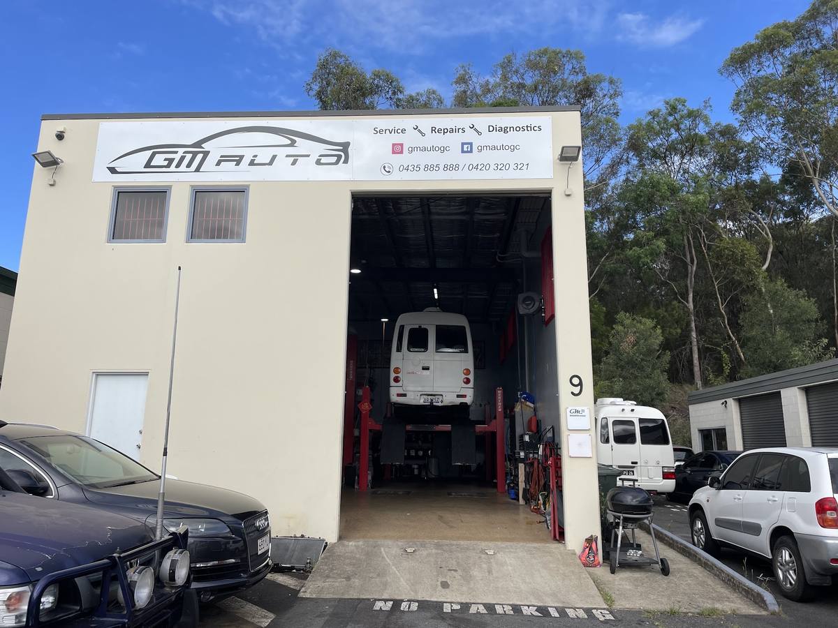 GM AUTO shopfront at unit 9, 27 Bailey Crescent, Southport, with the roller door open